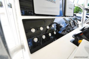 Yellow-Boat-Acrylic-Dash-On-Continental-Trailer-Bright-Close-Up-Left-Side-Cockpit-Helm-Buttons-And-Dash-With-Garmin-Dual-Moniters