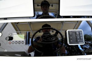 Yellow-Boat-Acrylic-Dash-On-Continental-Trailer-Close-Up-Dusky-Badge-On-Cockpit-Helm-Dash-With-Fusion-MS-NRX300-Radio