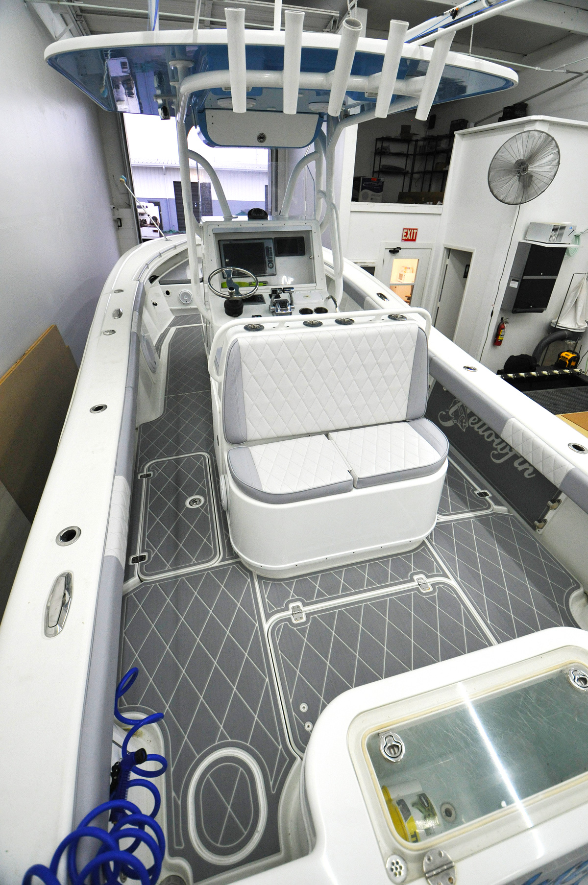 https://floridamarinecustoms.com/wp-content/uploads/2021/02/Yellowfin-Upholstery-Rear-view-of-Full-boat-with-roof.jpg