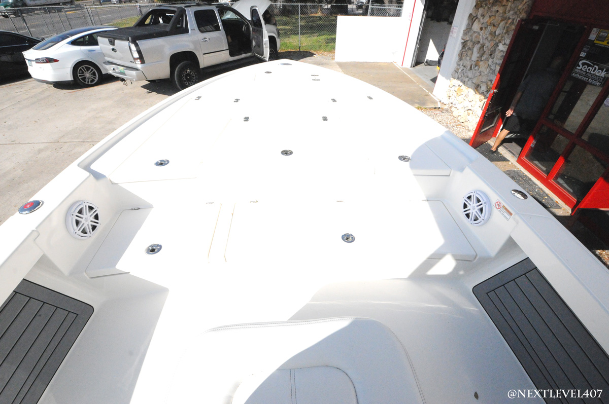 White-Pathfinder-Boat-On-Trailer-Next-Level-Inc-Store-Roof-JL-Audio-Speaker-Top-View-Front-Half-Lounge-With-Speakers