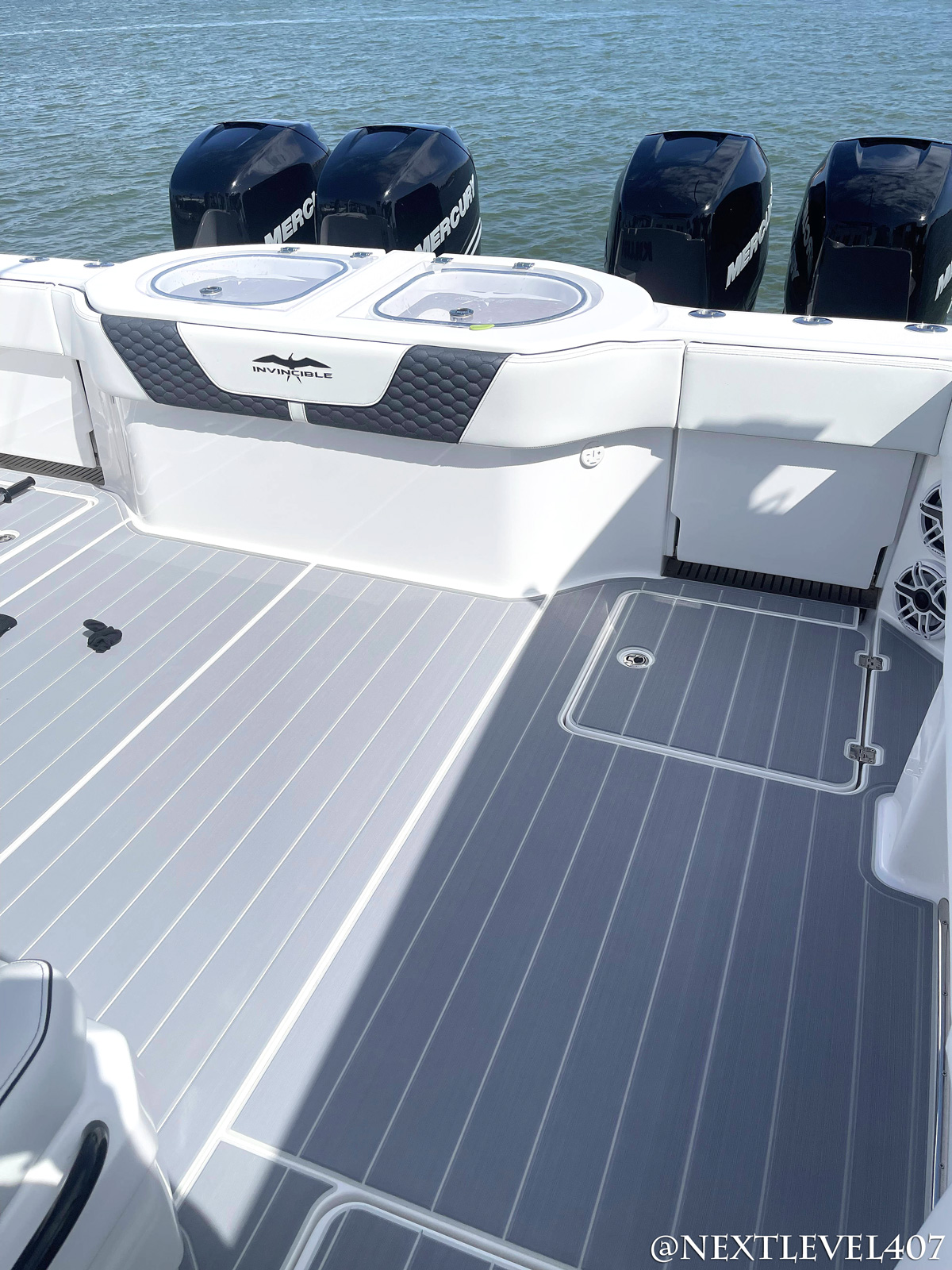 AFTER-Blue-Invincible-Boat-Custom-SeaDek-Marine-Flooring-Pad-Upgraded-Speakers-Full-Rear-Mercury-Engines-Custom-Logo-Pad-On-Water-Leather-Upholstery-Seats-Grey-Center-Console