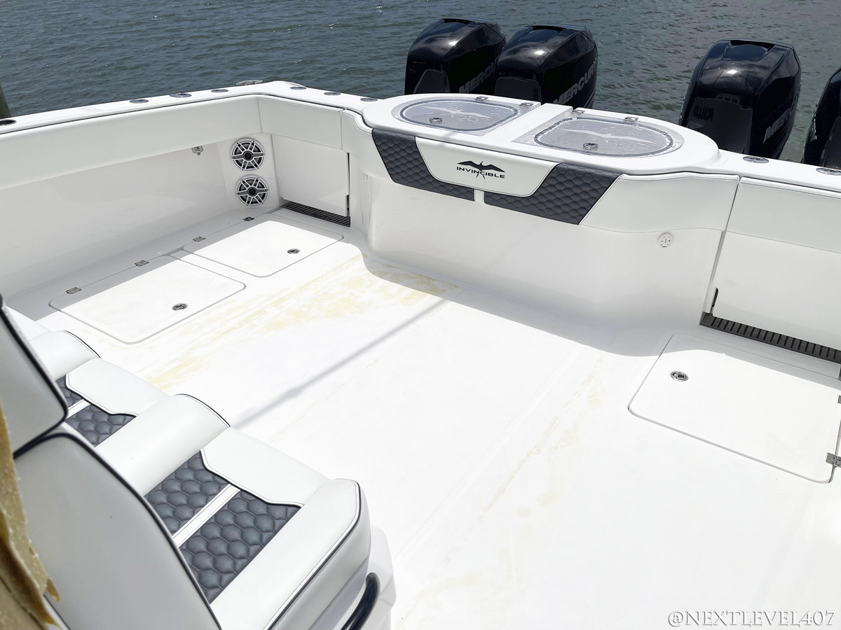 BEFORE-Blue-Invincible-Boat-Custom-SeaDek-Marine-Flooring-Pad-Upgraded-Speakers-Full-Rear-Mercury-Engines-Custom-Logo-Pad-On-Water-Leather-Upholstery-Seats-Grey-Center-Console